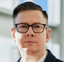 Foto di Alexander Hughes, executive e CEO di un'azienda di trading crypto